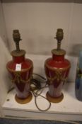 A pair of decorative classical style table lamps.