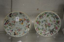 A pair of Chinese celadon plates painted with birds and insects.