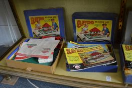 Four various Bayko boxed construction kits.