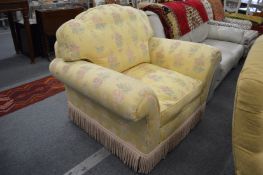 A good large floral upholstered armchair.