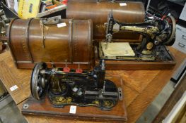 Two old sewing machines.