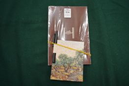 A Hermes notebook and another notebook.