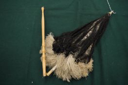 A ladies travelling parasol with folding handle.