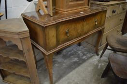 A walnut single drawer side table.