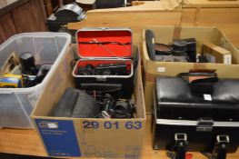 Large quantity of camera equipment and accessories.