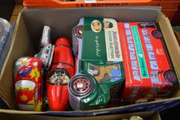 Decorative collectors tins modelled as vehicles.