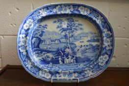 A large blue and white meat dish.