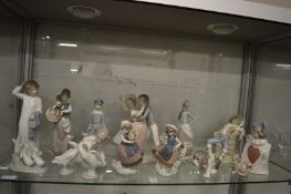 A large quantity of Lladro and Nao figures.