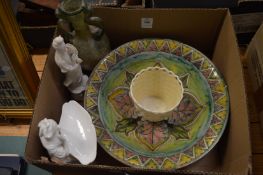 A Belleek basket shaped vase and other items.