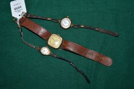 A group of three 9ct gold cased wristwatches.