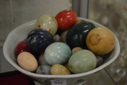 Porcelain bowl containing hard stone eggs.