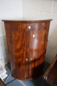 A good George III mahogany bow front hanging corner cupboard.