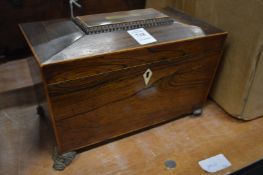 A Victorian rosewood sarcophagus shaped tea caddy.
