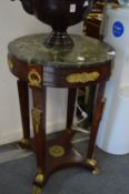 A French Empire style marble topped ormolu mounted mahogany circular occasional table.