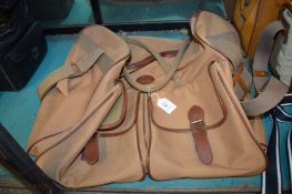 A canvas and leather holdall.