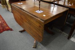 A mahogany pedestal Pembroke table.
