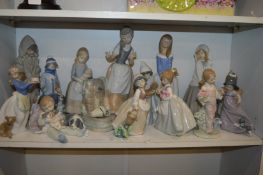 A group of Lladro and Nao porcelain figures.