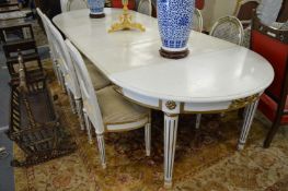 A Continental painted beech extending dining table with four leaves, extended size 320cm long x