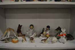A collection of Russian porcelain figures and animals.