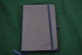 A Maxleaf dark blue leather notebook.