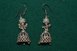 A pair of decorative earrings.
