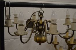 A Dutch style brass eight branch chandelier.