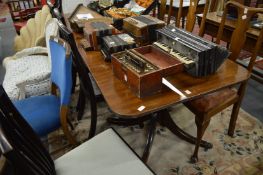 George III style mahogany twin pillar dining table with three leaves.