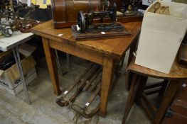 An oak draw leaf style dining table.