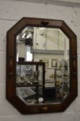 An oak framed wall mirror.