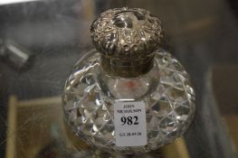 A silver mounted cut glass inkwell.
