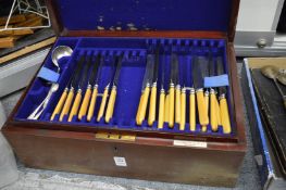 Mahogany cased part canteen of cutlery.