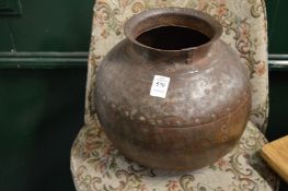 A riveted steel globular shaped vessel.