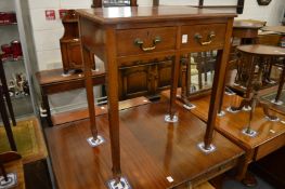 A mahogany two drawer side table.