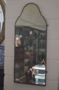 An arch topped mirror with etched decoration.