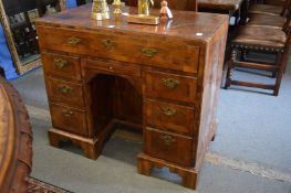 An 18th century walnut kneehole desk.