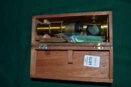 A boxed Culpeper style microscope.