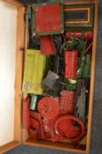 A box containing a large quantity of Meccano items.