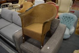 A gold painted Lloyd loom armchair.