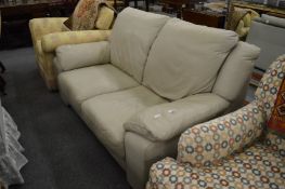 An modern grey leather upholstered two seater settee.