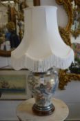 A Chinese vase lamp with shade.
