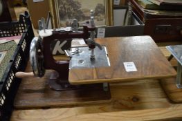 Two miniature sewing machines.