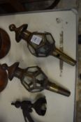 A pair of small brass coaching lamps.