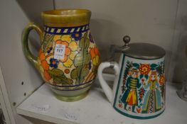 A Crown Ducal Charlotte Rhead decorated jug and a German stein.