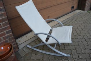 A modern outdoor rocking chair.