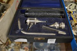 A cased item of medical equipment.