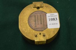 A reproduction brass compass.