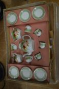 A childs porcelain tea set with original box.