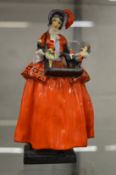 A Royal Doulton figurine of the Toy Seller.