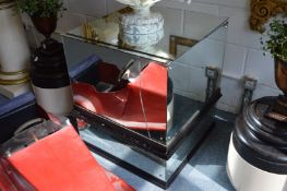 A large square shaped mirrored pedestal stand (faults).