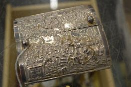 A Continental white metal cigarette box with embossed hinged covers.